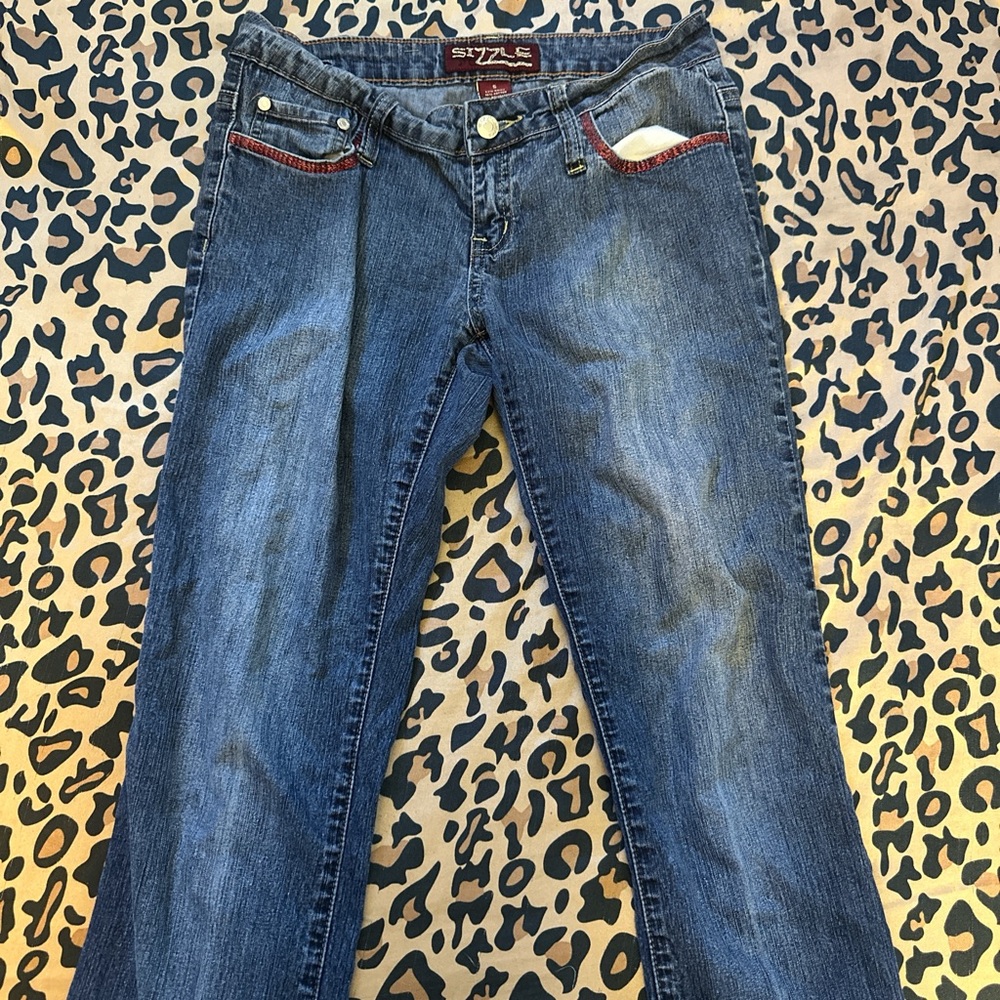 low rise bootcut sizzle jeans with red designs